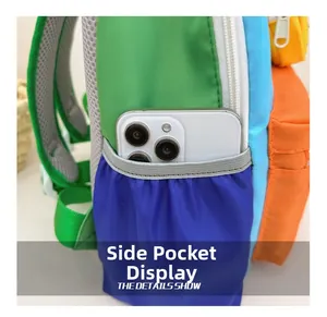 Close-up of elastic mesh side pocket on a colorful kids backpack for phone storage