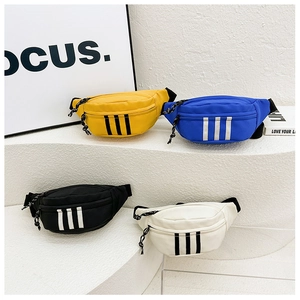 Detail view of colorful nylon kids chest bags with sporty vertical stripes and zippers