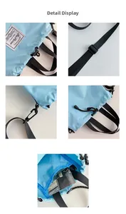 Detail view of light blue drawstring bucket bag with ripstop texture and metal hooks