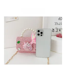 Pink sequin mermaid crossbody bag for girls size compared with a smartphone