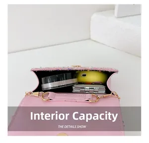 Internal capacity of pink sequin mini bag showing space for makeup and daily items