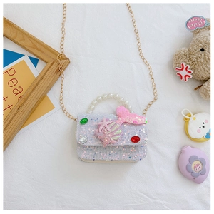 Detail of sequin kids crossbody bag with mermaid tail, pearl handle and gold chain
