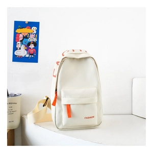 Close-up of white minimalist kids chest bag with orange zipper and FASHION lettering