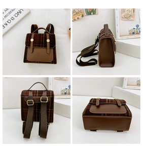 Detail view of mini vintage British plaid backpack for kids with brown leather straps