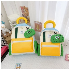 Detail of color-block kids backpack with detachable cactus coin purse in two sizes