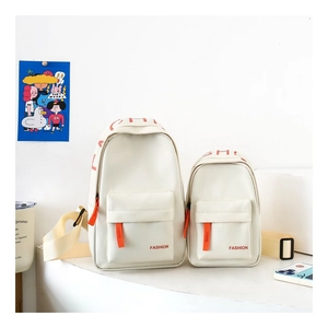 Detailed view of fashion children's cream-white chest bag with orange zippers and strap