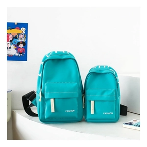 Detail of waterproof nylon chest bags in bright blue with white fashion letter prints