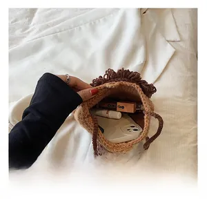 Internal view of handmade crochet lion bag showing capacity for phone and cosmetics
