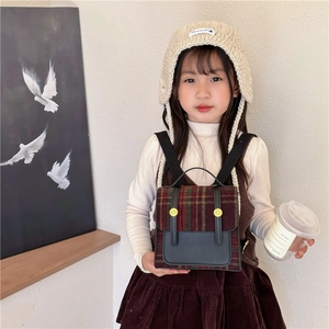 Vintage kids plaid backpack in retro British style with leather trim and gold button