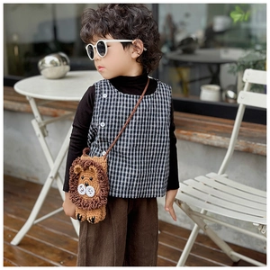 Detail of handmade crochet lion crossbody bag for girls with 3D mane and woven strap