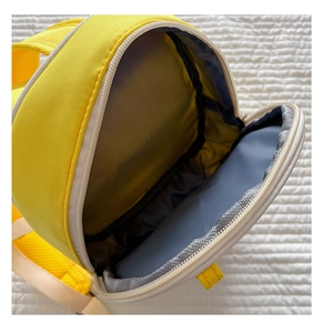 Top view detail of the wide interior compartment of the yellow waterproof kids backpack