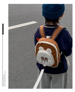Detail view of cartoon corgi backpack with detachable anti-lost safety leash for kids