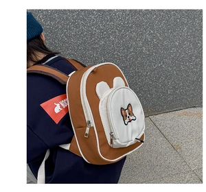 Detail shot of cute corgi embroidery and 3D ears on a waterproof oxford kids backpack