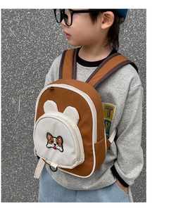 Detail of cute Corgi embroidery on children's waterproof brown Oxford backpack