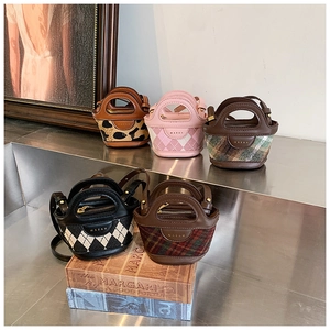 Detail showing five mini cylinder bags with various patterns and Marah brand logo