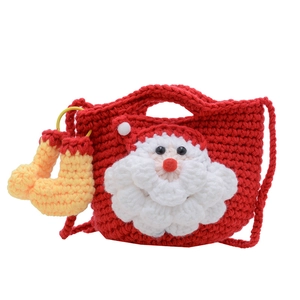 Handmade Santa Claus crochet shoulder bag for children with festive red knit texture