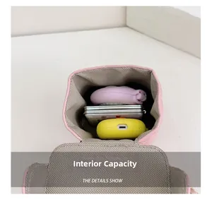 Internal capacity of pink quilted bucket bag showing storage for small accessories