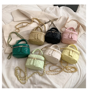 Collection of seven mini quilted leather crossbody bags with gold chain straps for girls