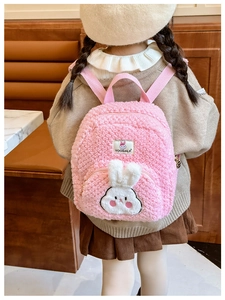 Detailed back view of pink plush rabbit backpack for toddlers featuring soft lamb wool texture