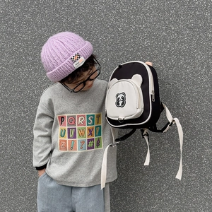 Cute panda backpack for kids with purple knit beanie and casual grey sweatshirt outfit
