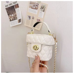 Detail of white quilted mini bucket bag with gold turn-lock and chain strap for girls