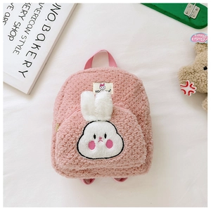 Close-up of pink fleece toddler backpack featuring cute bunny embroidery and plush ears