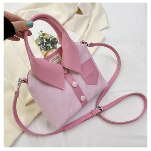 Close-up of light pink bucket bag with creative shirt collar design and decorative buttons