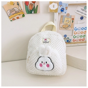 Close-up of white plush bunny backpack featuring cute 3D ears and teddy fleece texture