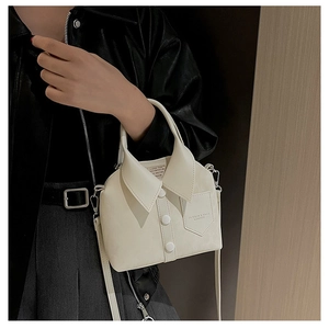 Detail of creative shirt-style bucket bag with white buttons and mini front pocket