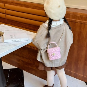 Pink quilted mini bucket bag for girls with gold twist lock and chain strap