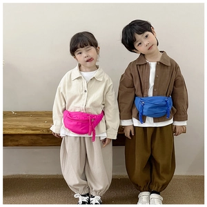 Close-up of vibrant pink and bright blue children crossbody chest bags with woven zippers