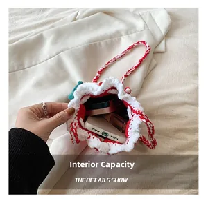 Detail view of handmade crochet Christmas storage bag showing internal capacity for items