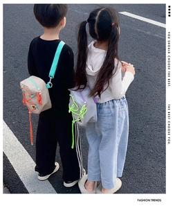 Close-up of kids crossbody bag with contrast rope detail and cute bear icon