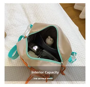 Internal capacity of kids nylon crossbody bag showing main compartment with small essentials
