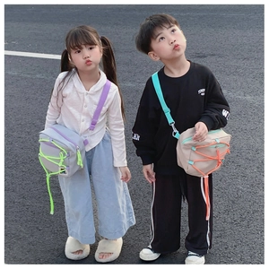 Close-up of children's stylish crossbody bag with colorful drawstring details