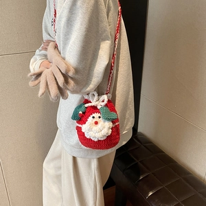 Handmade crochet Santa Claus shoulder bag for kids with red yarn and white beard details