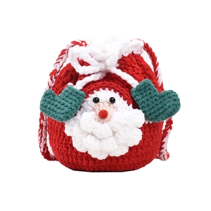 Handmade knitted Christmas Santa drawstring pouch in red, white and green wool colors