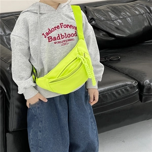 Fluorescent yellow nylon kids crossbody chest bag with adjustable strap and charm