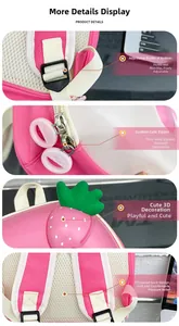 Pink kids backpack detail showing adjustable buckles, strawberry 3D decor and mesh back