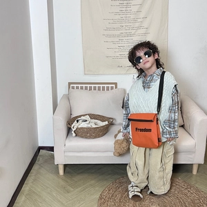 Vibrant orange canvas crossbody bag with Freedom lettering for boys and girls