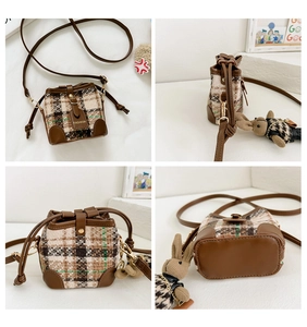 Detailed views of girls' quilted bucket bag with adjustable strap and rabbit charm
