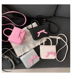 Mini crossbody bags featuring sweet bows in pink, black, silver, and cream white colors