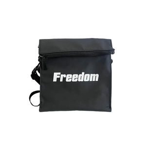 Minimalist black nylon crossbody bag for kids featuring a white Freedom print