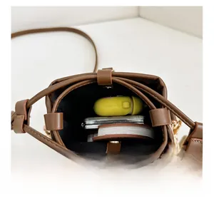 Internal view of brown quilted bucket bag showing storage capacity for daily essentials