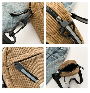 Détails du sac bandoulière en velours côtelé marron montrant zip, tissu et crochets