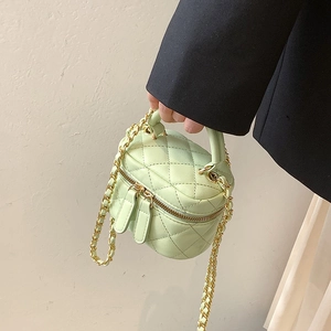 Mint green quilted mini handbag with gold chain strap and dual zipper closure for girls