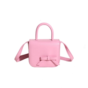 Pink mini crossbody bag with decorative 3D bow and elegant curved handle for women