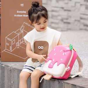 Pink ice cream shaped hardshell kids backpack with strawberry 3D detail and cone design