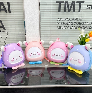 Detailed row of cute waterproof cartoon rabbit eggshell backpacks for toddlers in four colors
