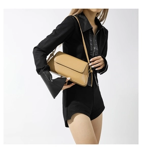 Detail of khaki square shoulder bag in smooth faux leather with slim shoulder strap